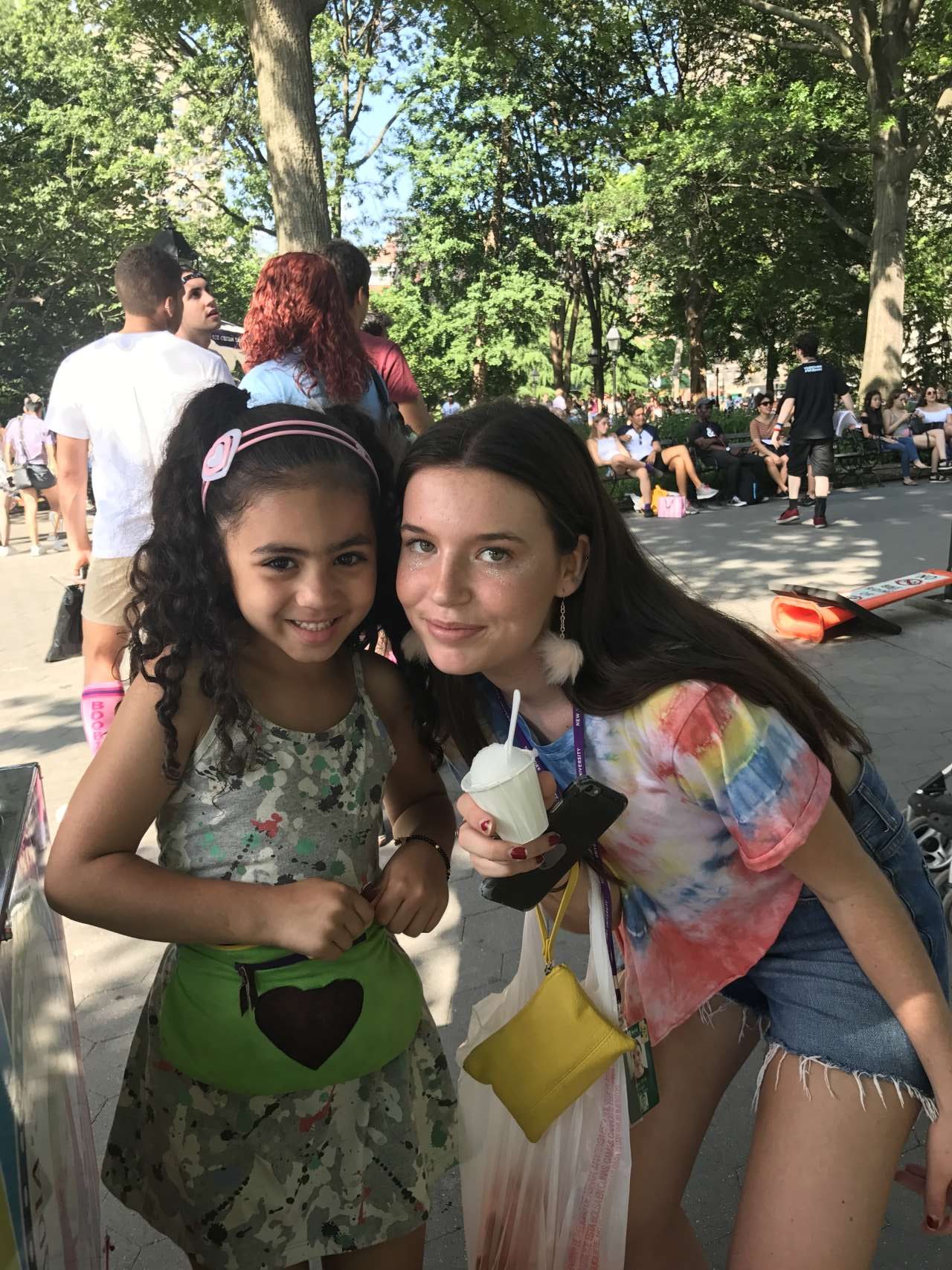 2 girls posing for a photo with lemon italian ice and India Jolie in park